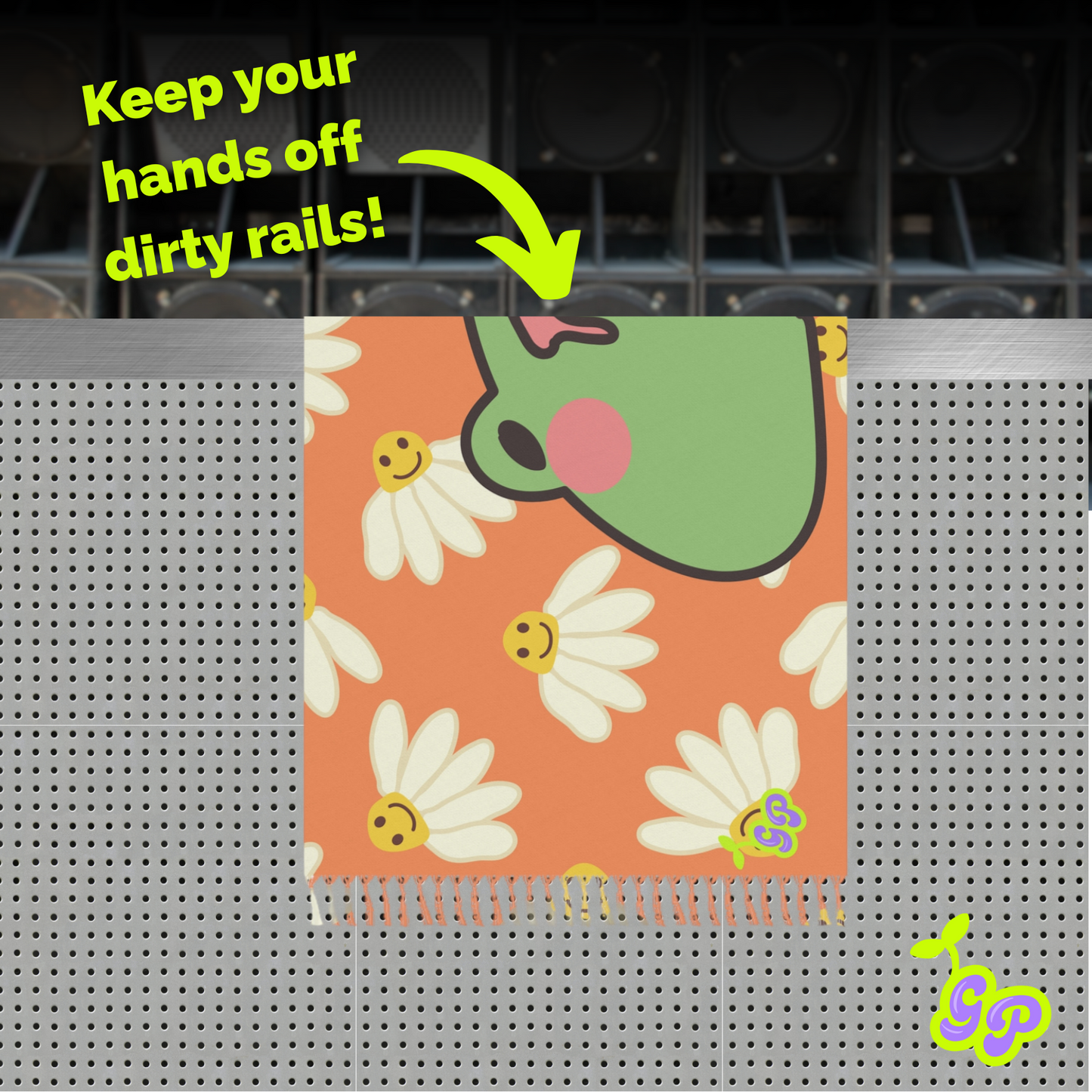 Cartoon frog and daisy print pashmina displayed over a perforated metal rail with the caption “Keep your hands off dirty rails!”