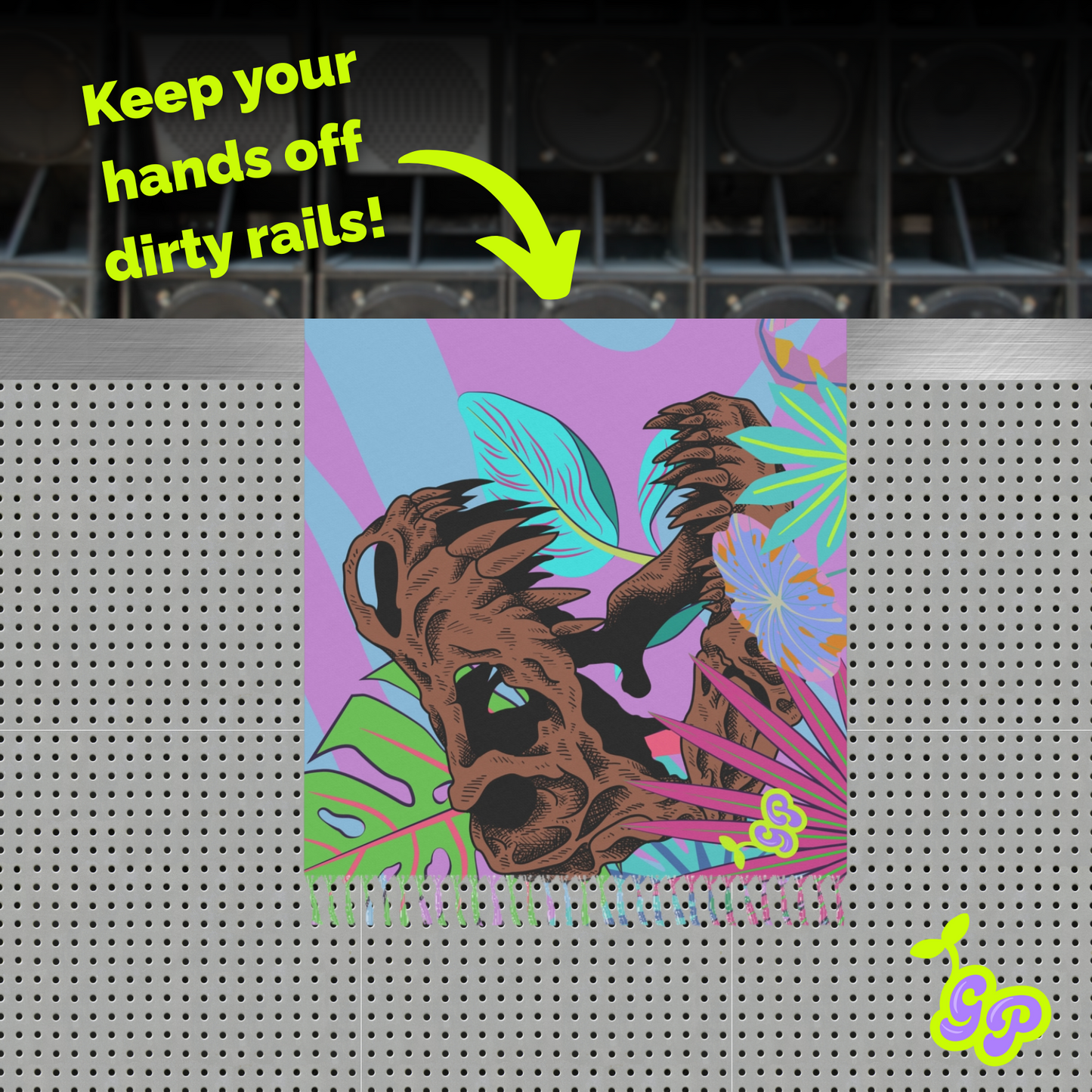 Dinosaur skull print Ground Pash draped over a metal rail barrier at a festival, with text saying "Keep your hands off dirty rails!"