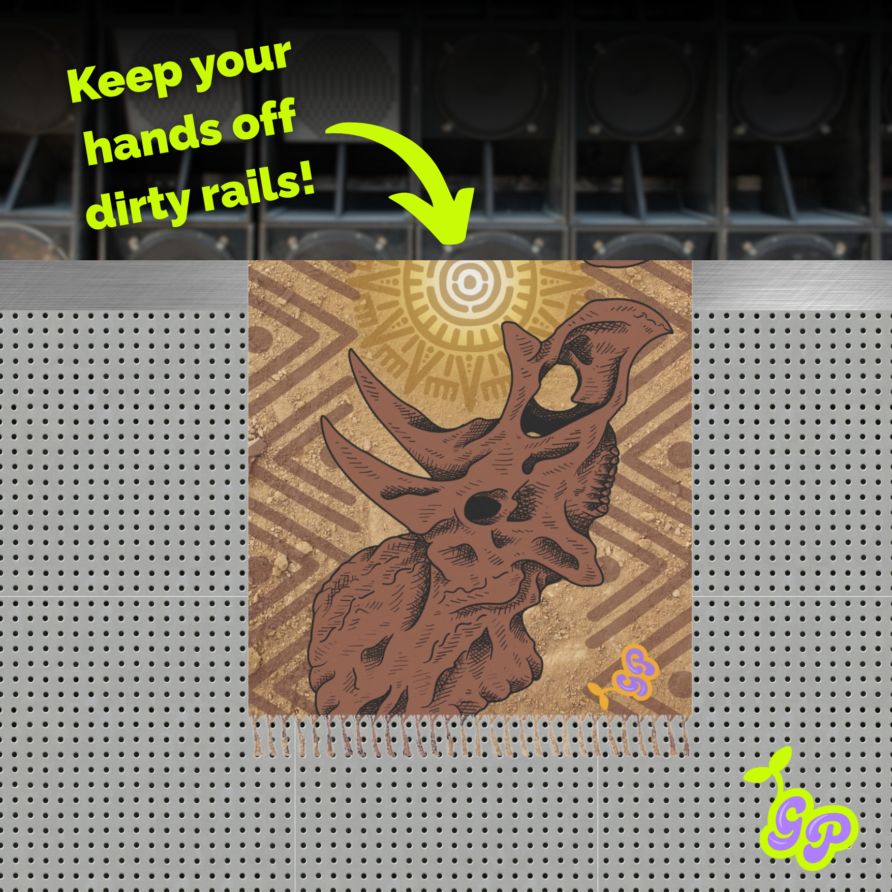 Festival pashmina with a single triceratops skull design and bold green text that says “Keep your hands off dirty rails!” displayed on a perforated speaker platform background.