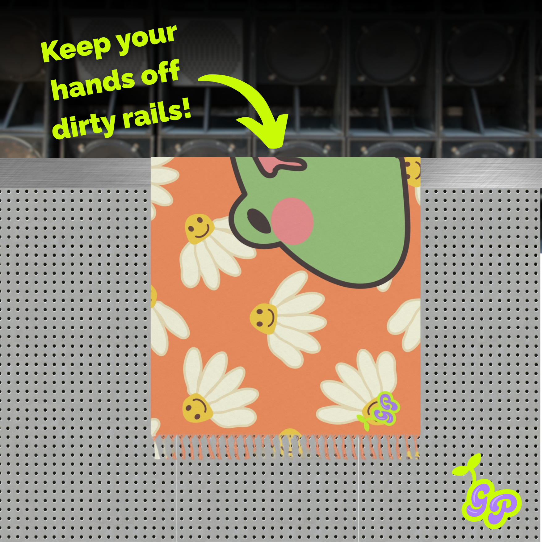 Cartoon frog and daisy print pashmina displayed over a perforated metal rail with the caption “Keep your hands off dirty rails!”